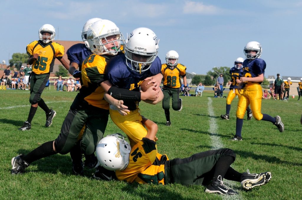 Group of kids playing football