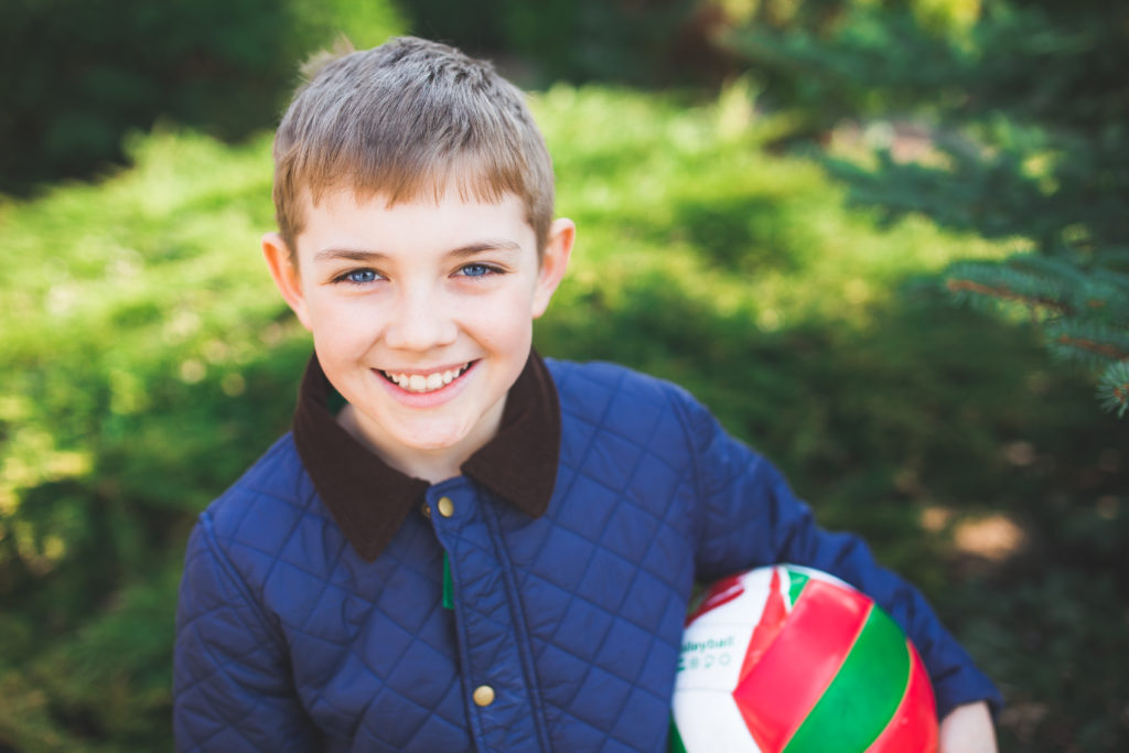 Boy smiling with ball